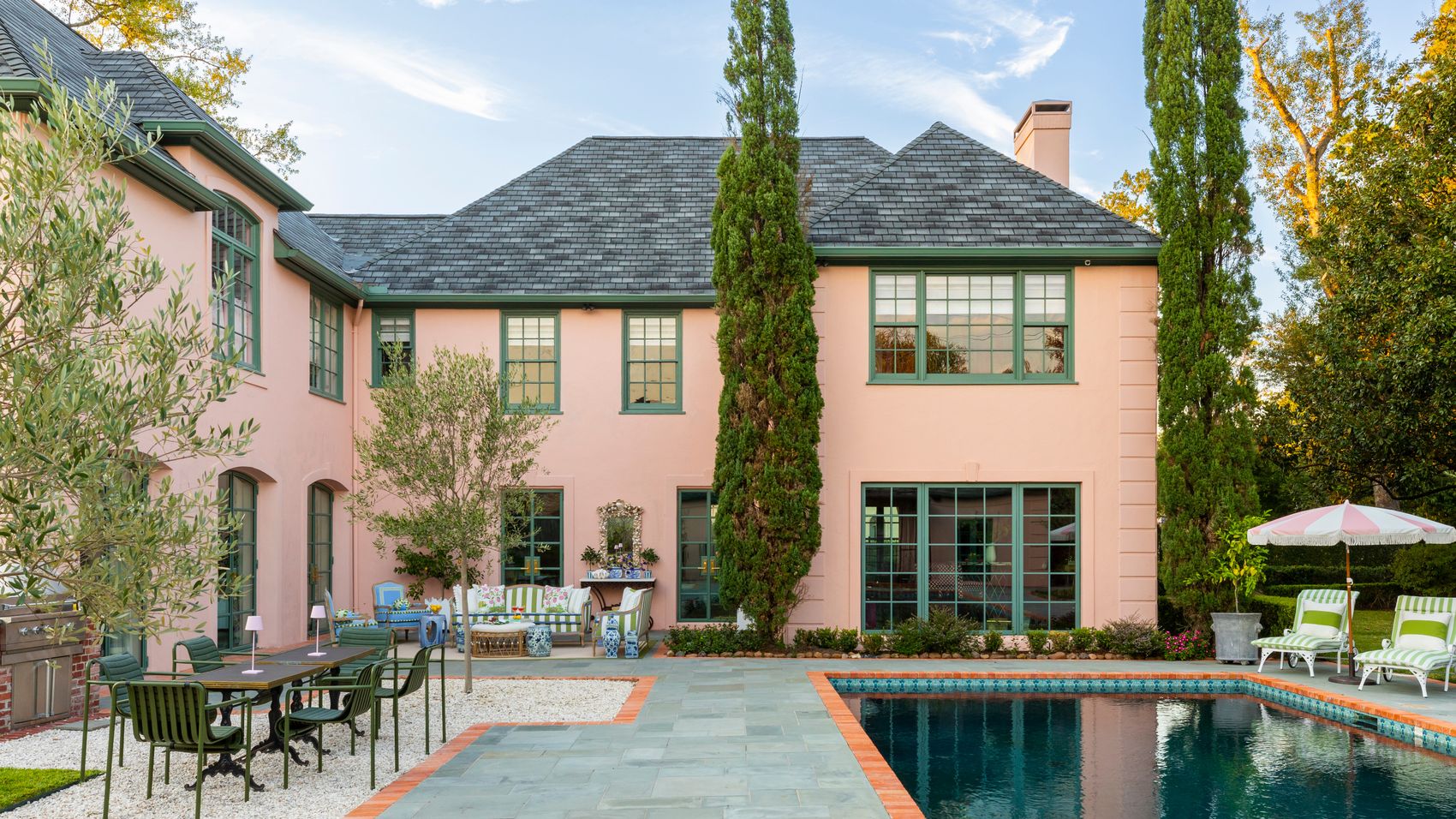Rear exterior and pool of a River Oaks home with integrated outdoor technology