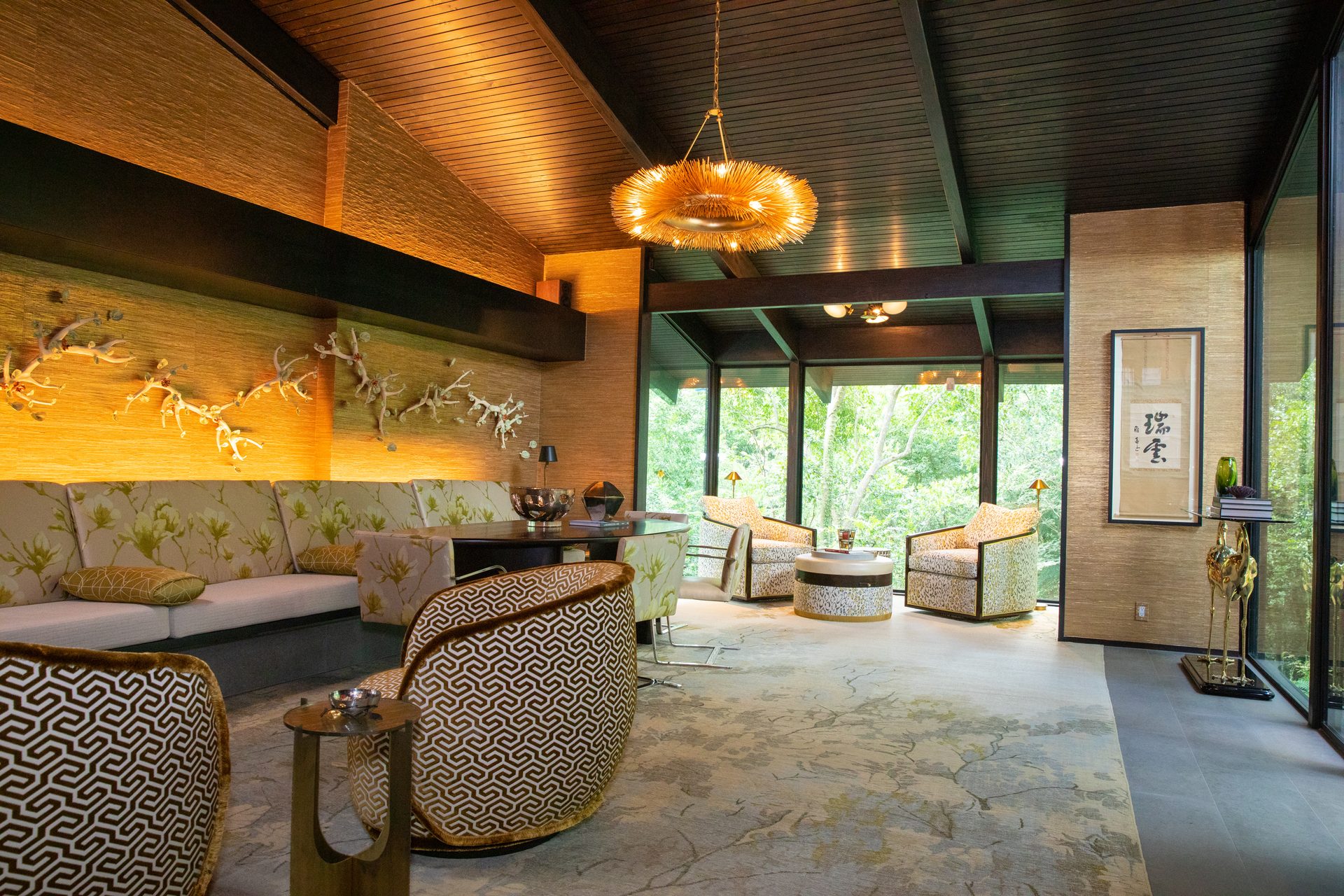 Layered lighting on a sculptural art wall in a River Oaks mid-century modern living room by Media Systems Houston