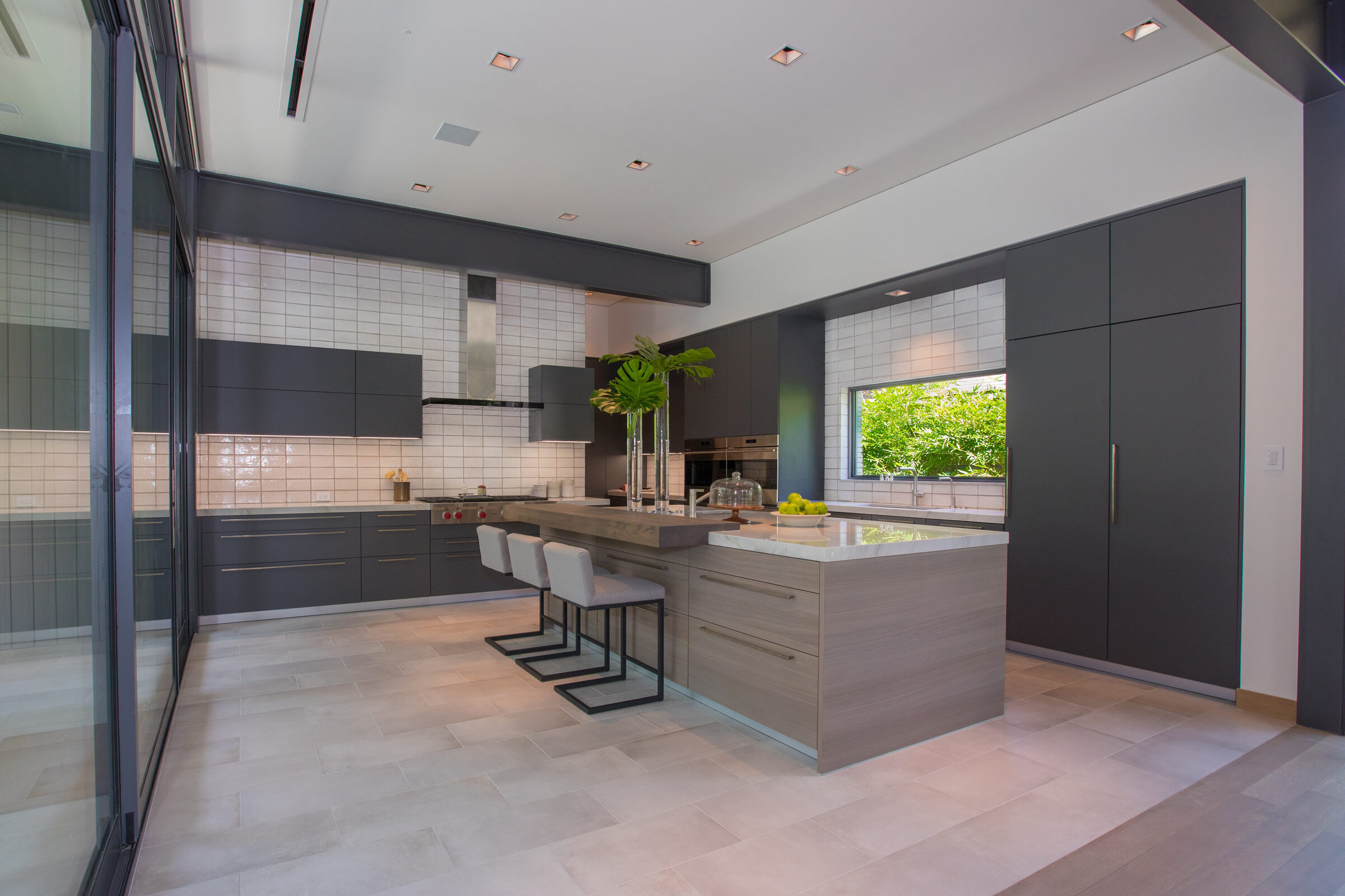 Modern kitchen with a floor to ceiling glass door