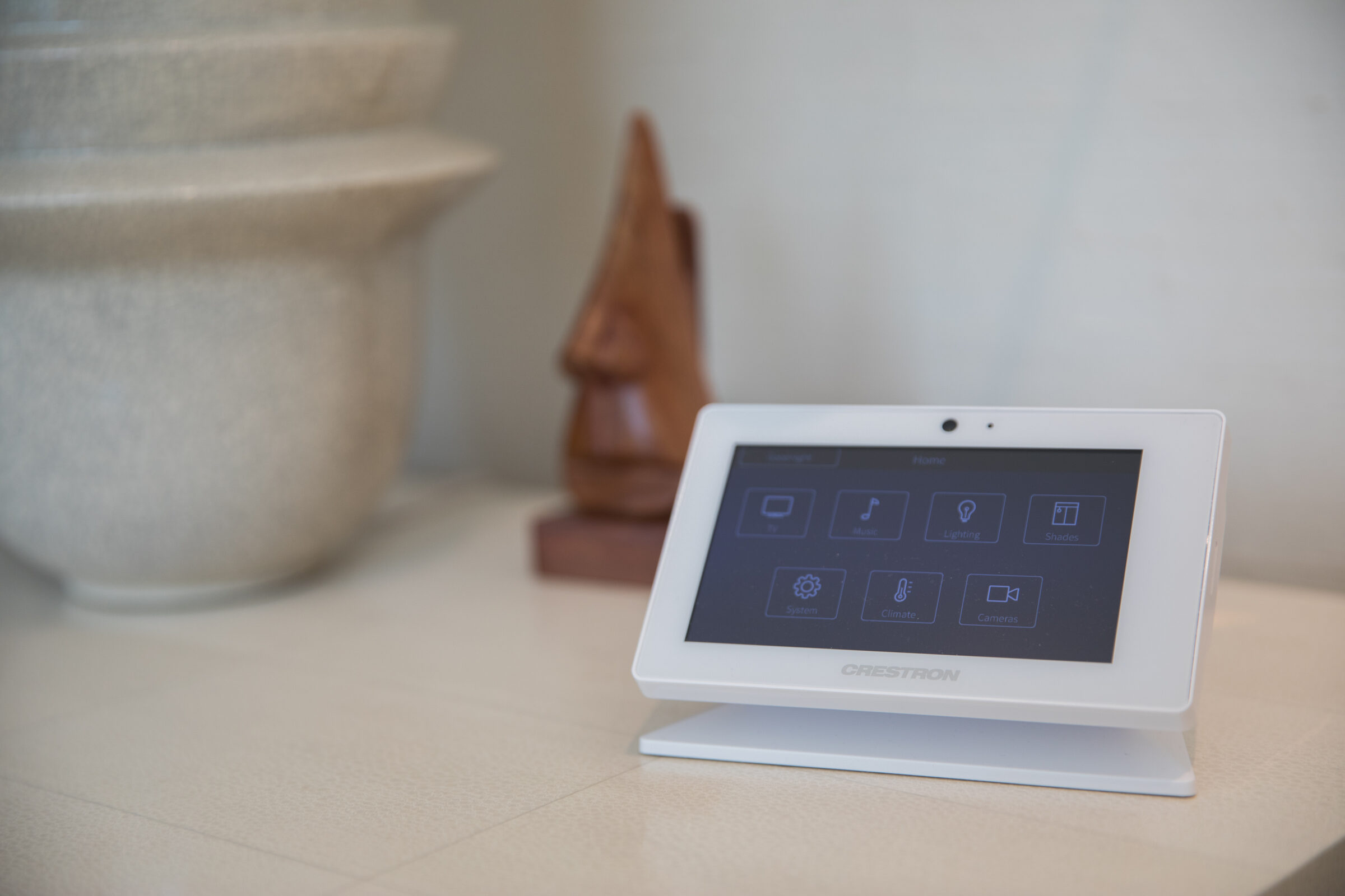 Crestron touch panel showing the whole home control menu