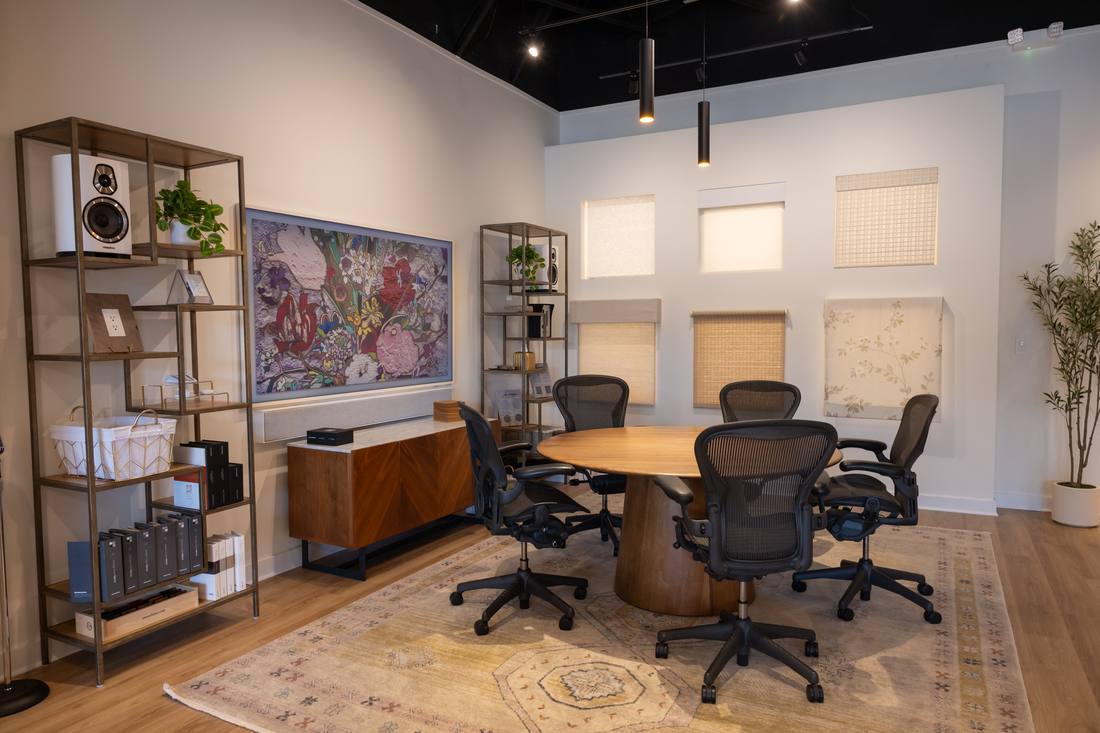 Conference room with motorized shade and drapery samples on display at the Houston Design Center